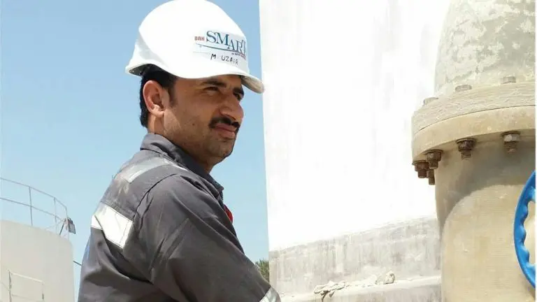 photo of an operator monitor a sewage treatment plant