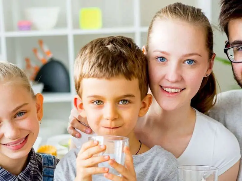 Family enjoy drinking treated water